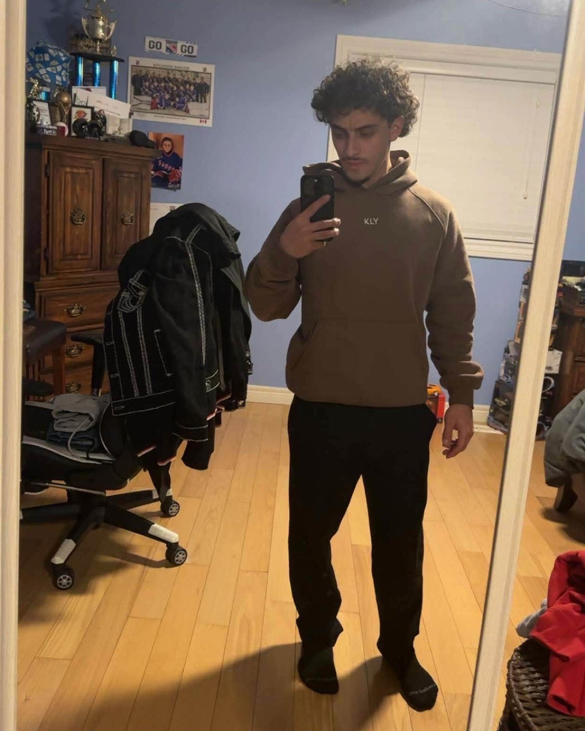 Antonio wearing the KLY hoodie in Mocha