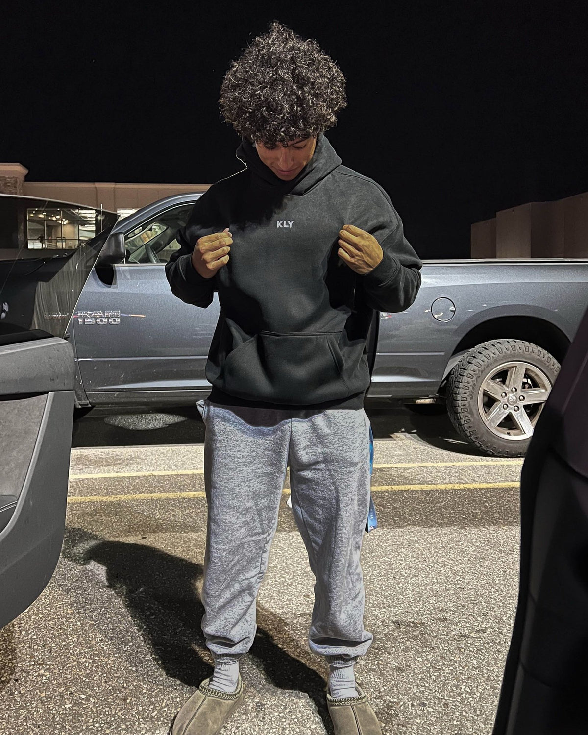 Josh wearing the KLY hoodie in Black